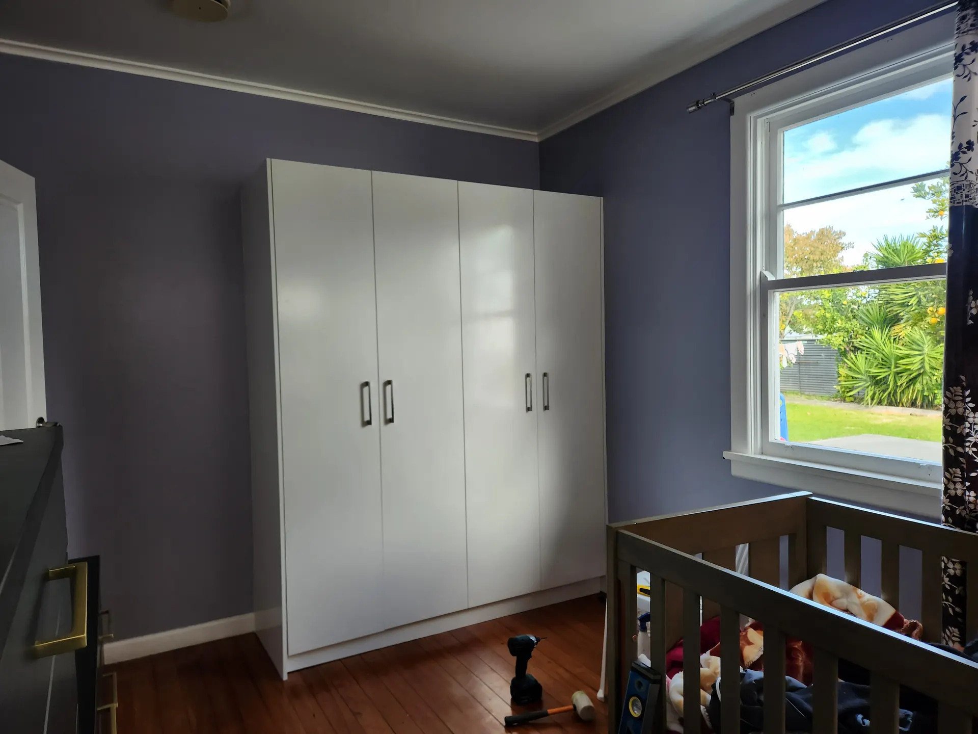 Custom villa bedroom wardrobes with shelving and hanging space by Flow Joinery